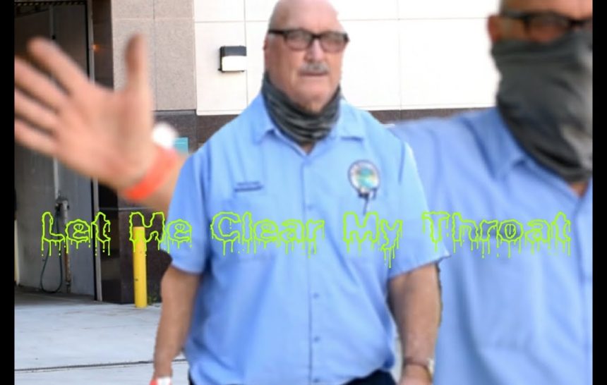 Male Karen County Worker Coughs On Photographer